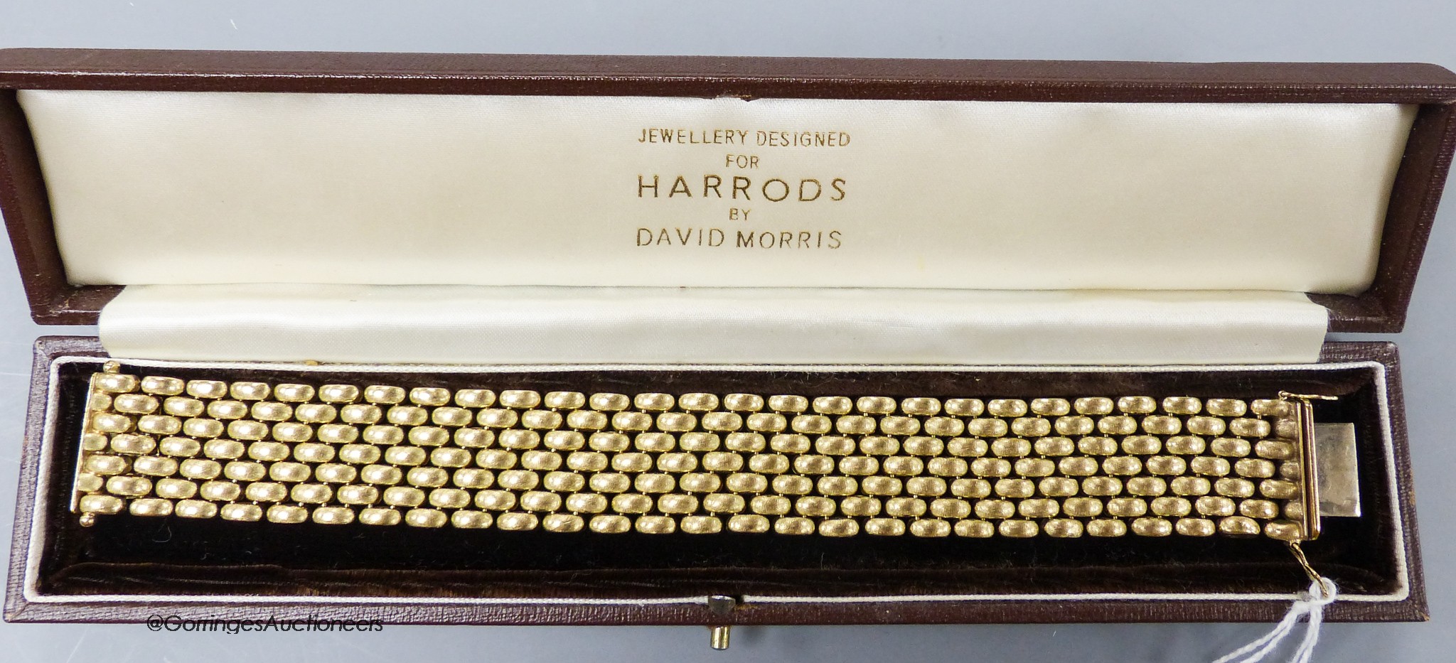 A modern 9ct gold demi-lune brick link bracelet, 19.1cm